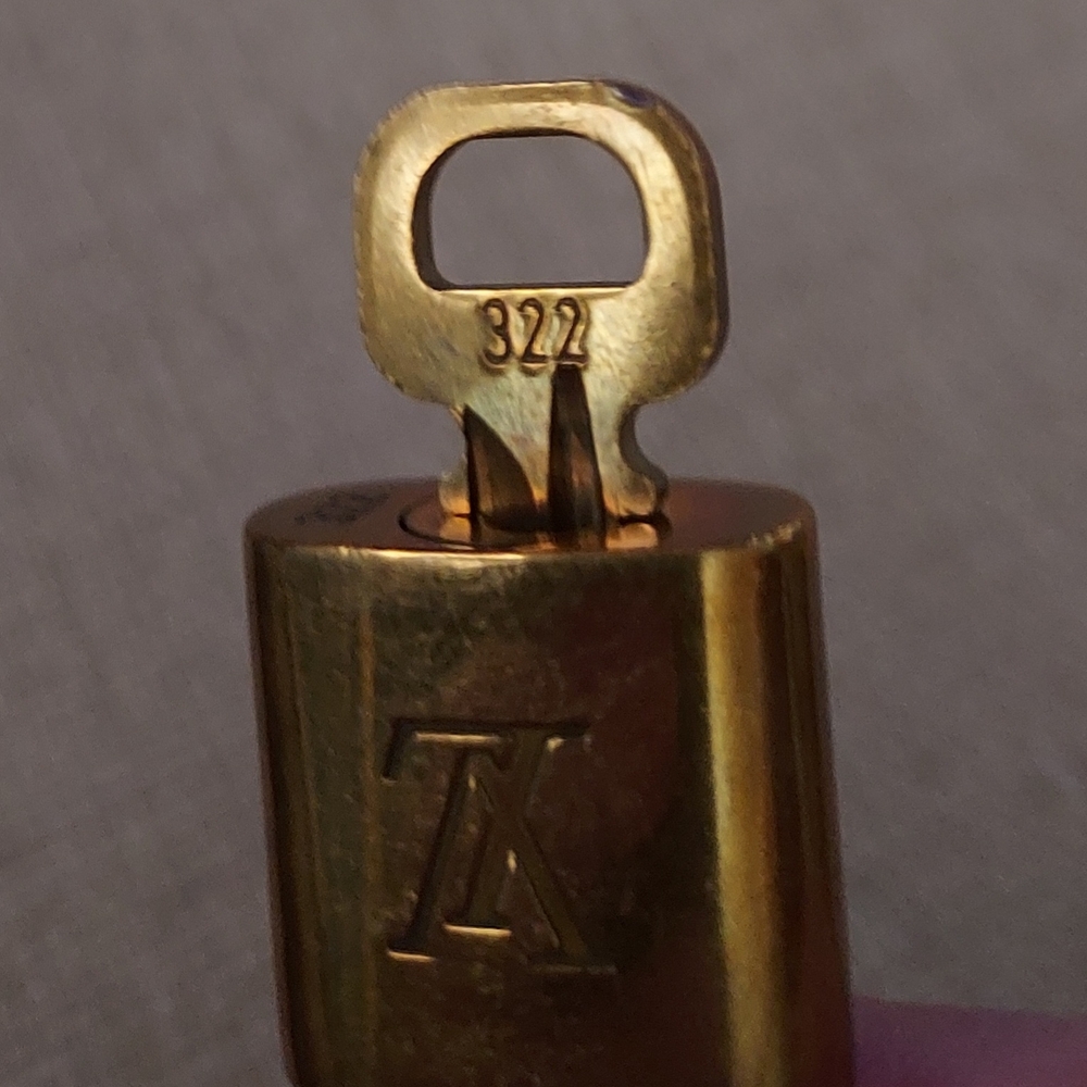 Louis Vuitton Gold Lock